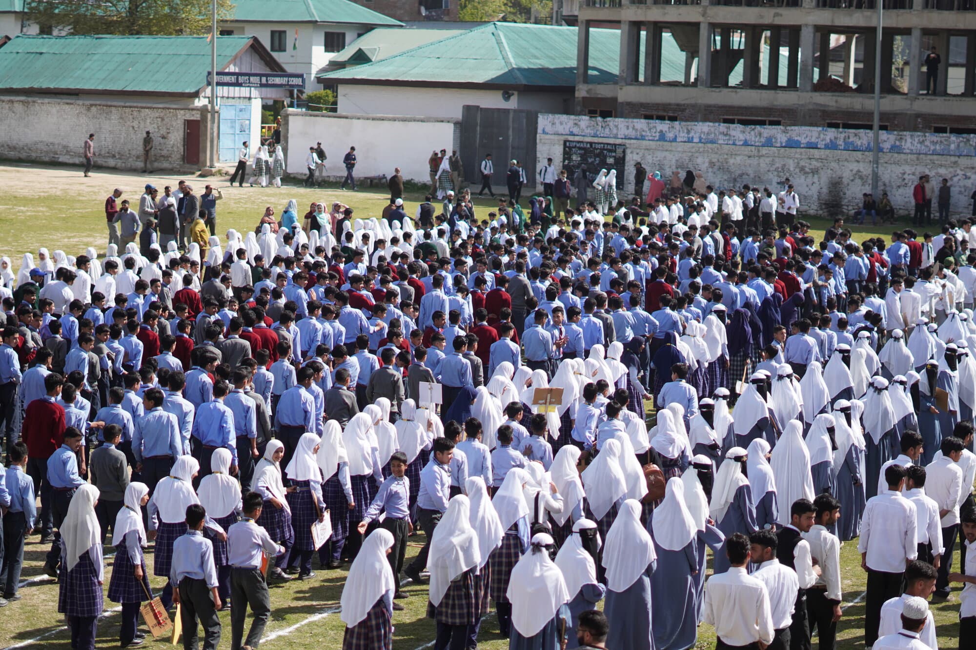 Full school assembly on the ground in front of the KPS building