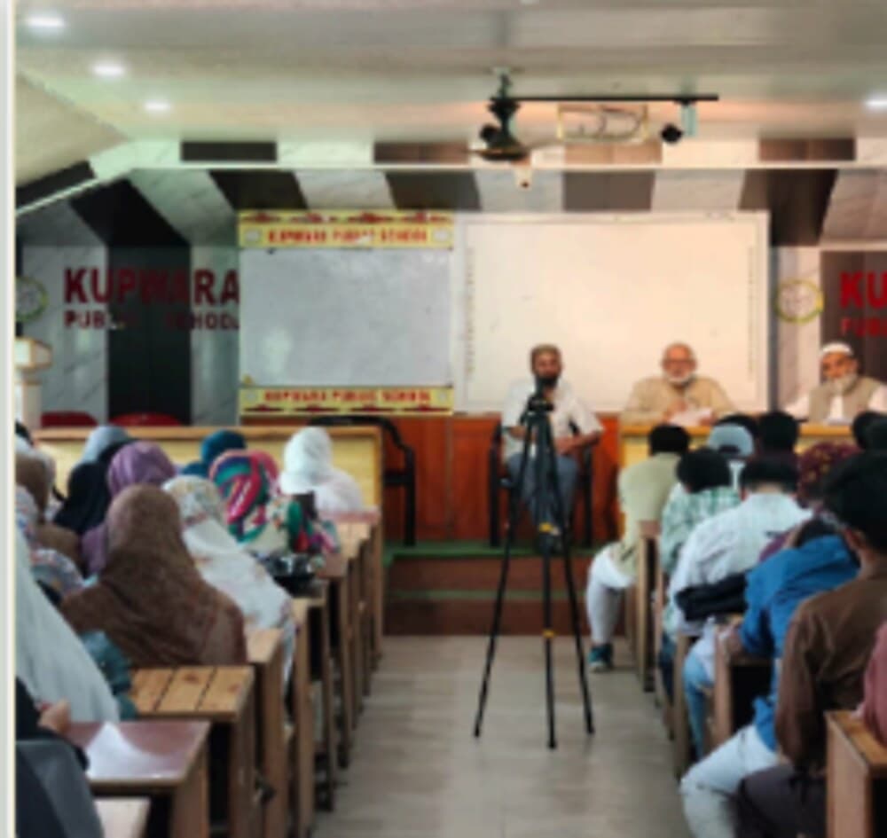 A seminar in progress in the school auditorium
